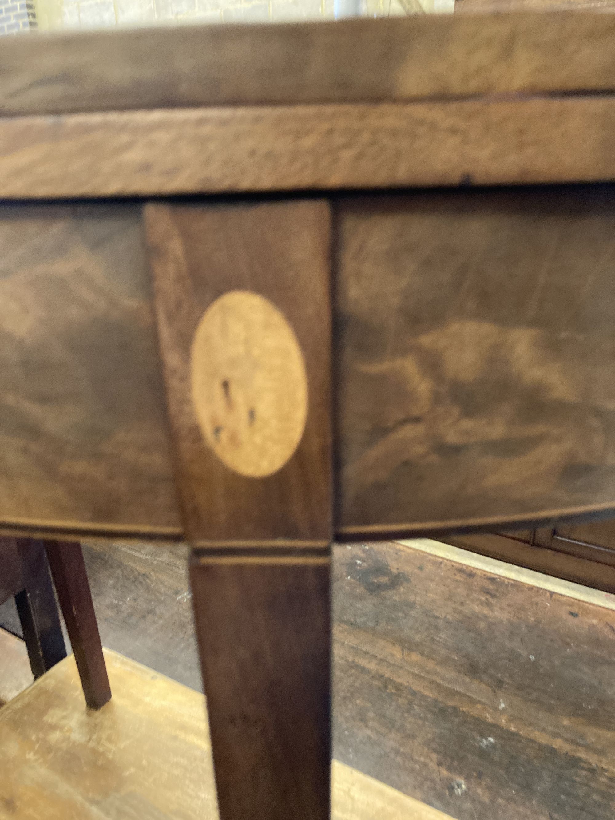 A George III inlaid mahogany demi lune folding tea table, width 78cm, depth 38cm, height 74cm